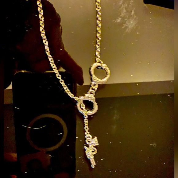 Handgun and handcuff necklace Stainless Steel NWOT - Picture 1 of 5